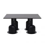 Thumbnail of http://Une%20table%20rectangulaire%20noire%20élégante%20et%20moderne%20avec%20quatre%20pieds%20cylindriques%20robustes,%20chaque%20pied%20s'élargissant%20vers%20la%20base%20pour%20former%20une%20forme%20de%20cloche.%20Le%20design%20est%20minimaliste%20et%20contemporain,%20avec%20des%20lignes%20épurées%20et%20une%20surface%20lisse.